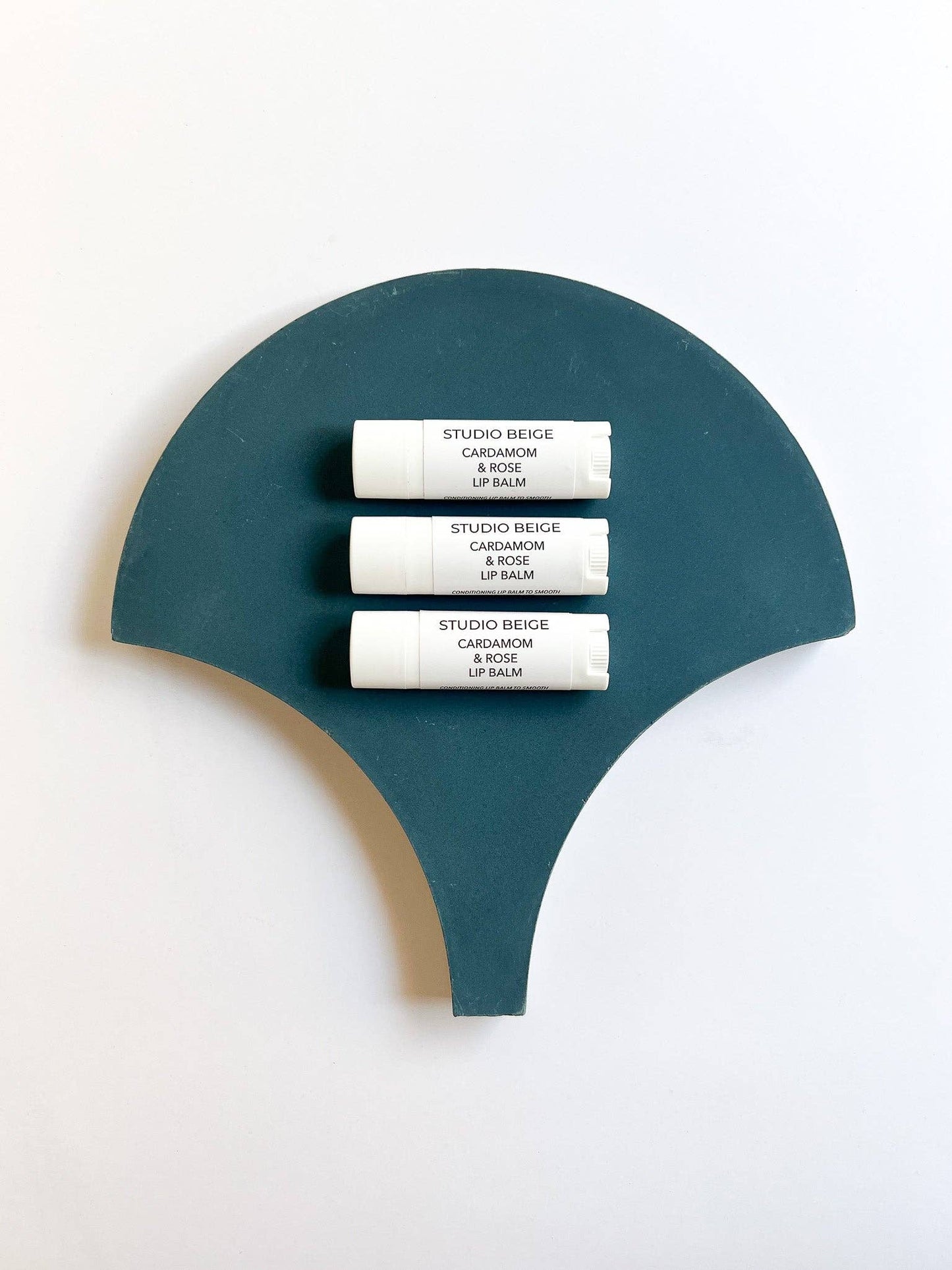 STUDIO BEIGE CARDAMOM & ROSE conditioning lip balm with cardamom, rose, & mango butter