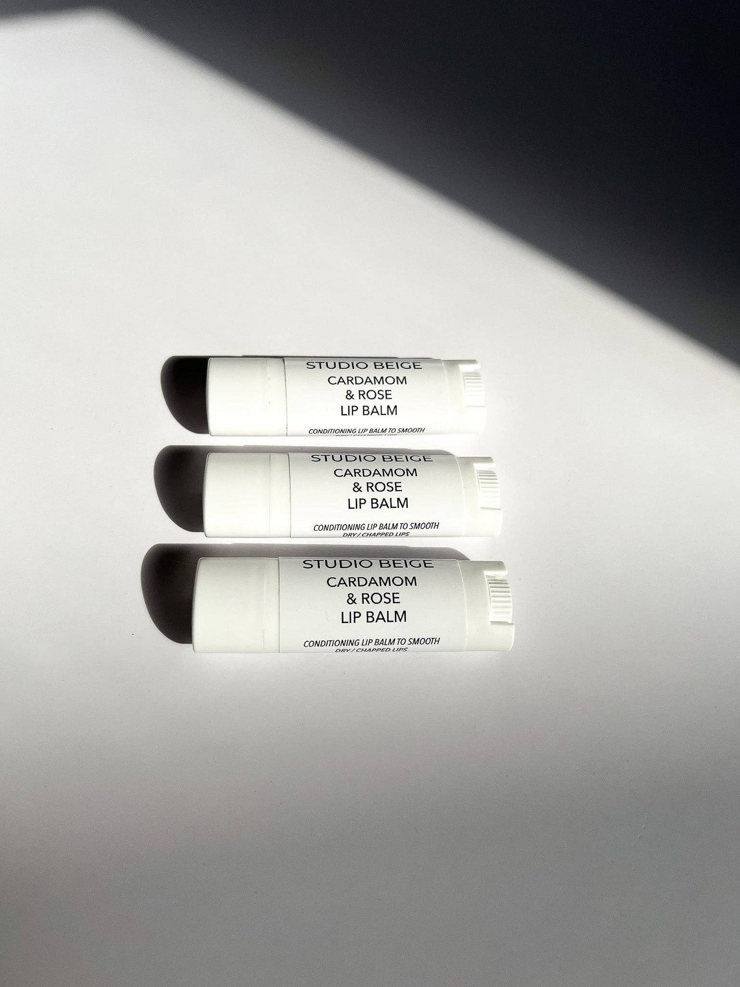 STUDIO BEIGE CARDAMOM & ROSE conditioning lip balm with cardamom, rose, & mango butter