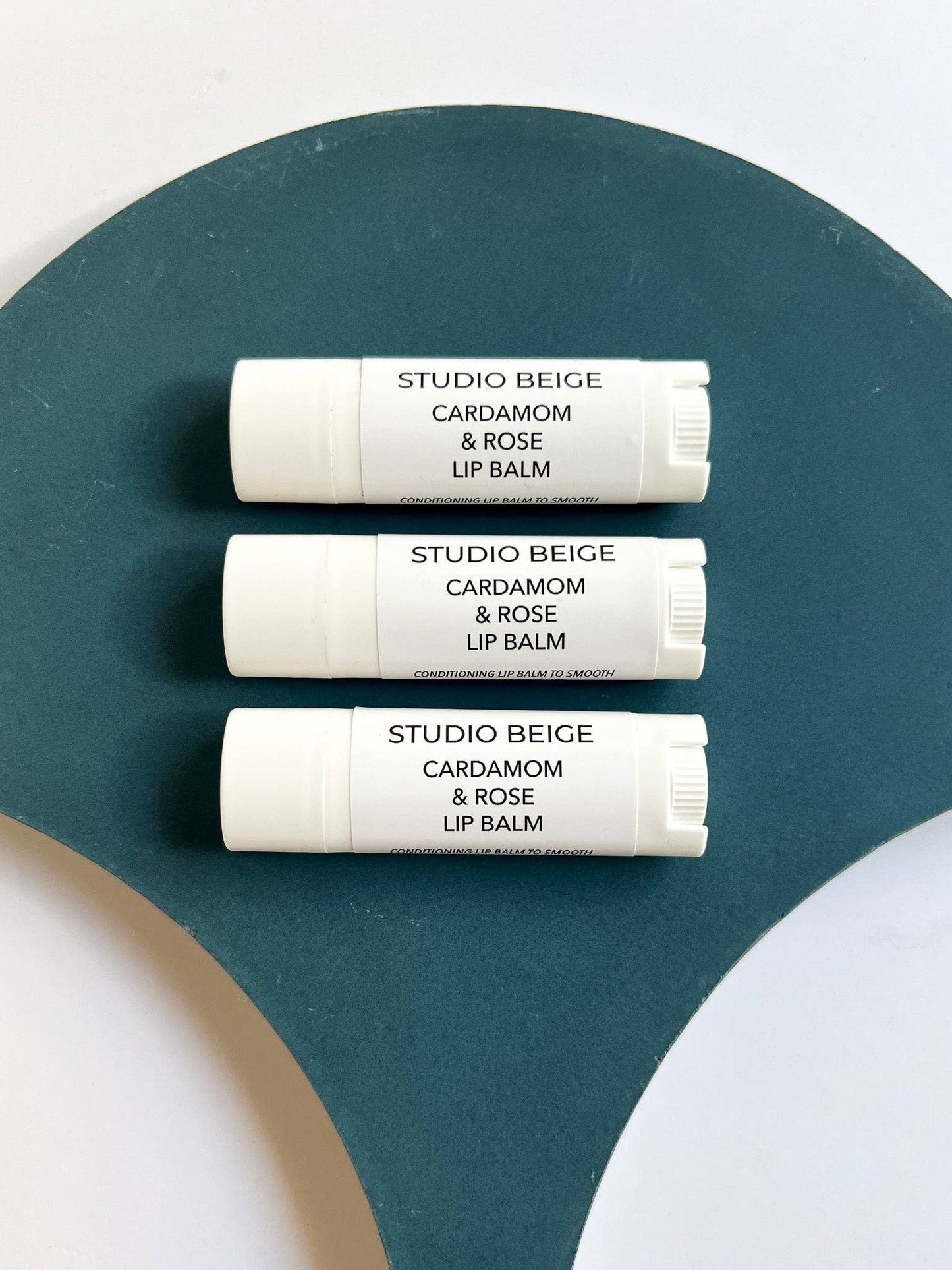 STUDIO BEIGE CARDAMOM & ROSE conditioning lip balm with cardamom, rose, & mango butter
