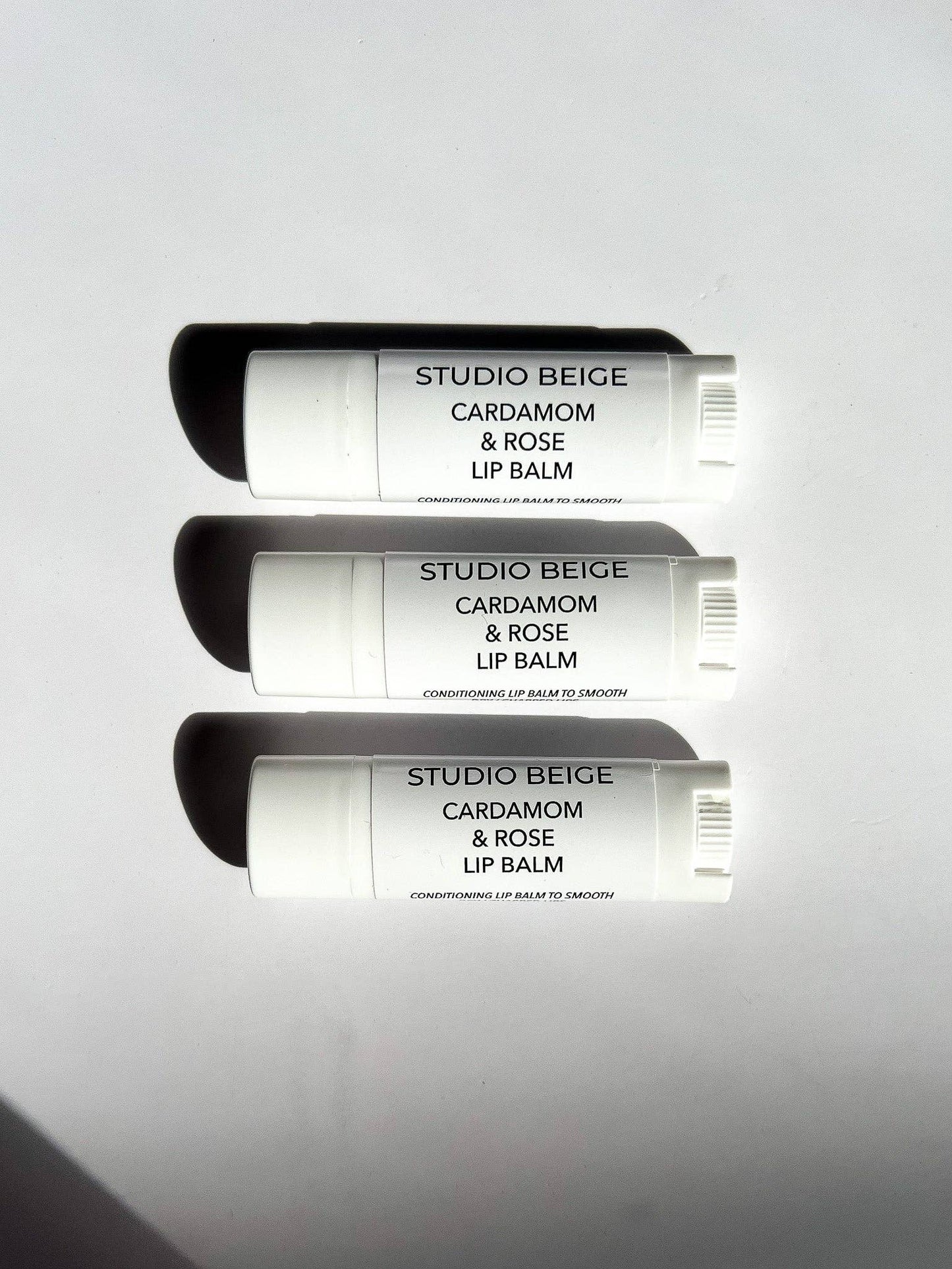 STUDIO BEIGE CARDAMOM & ROSE conditioning lip balm with cardamom, rose, & mango butter