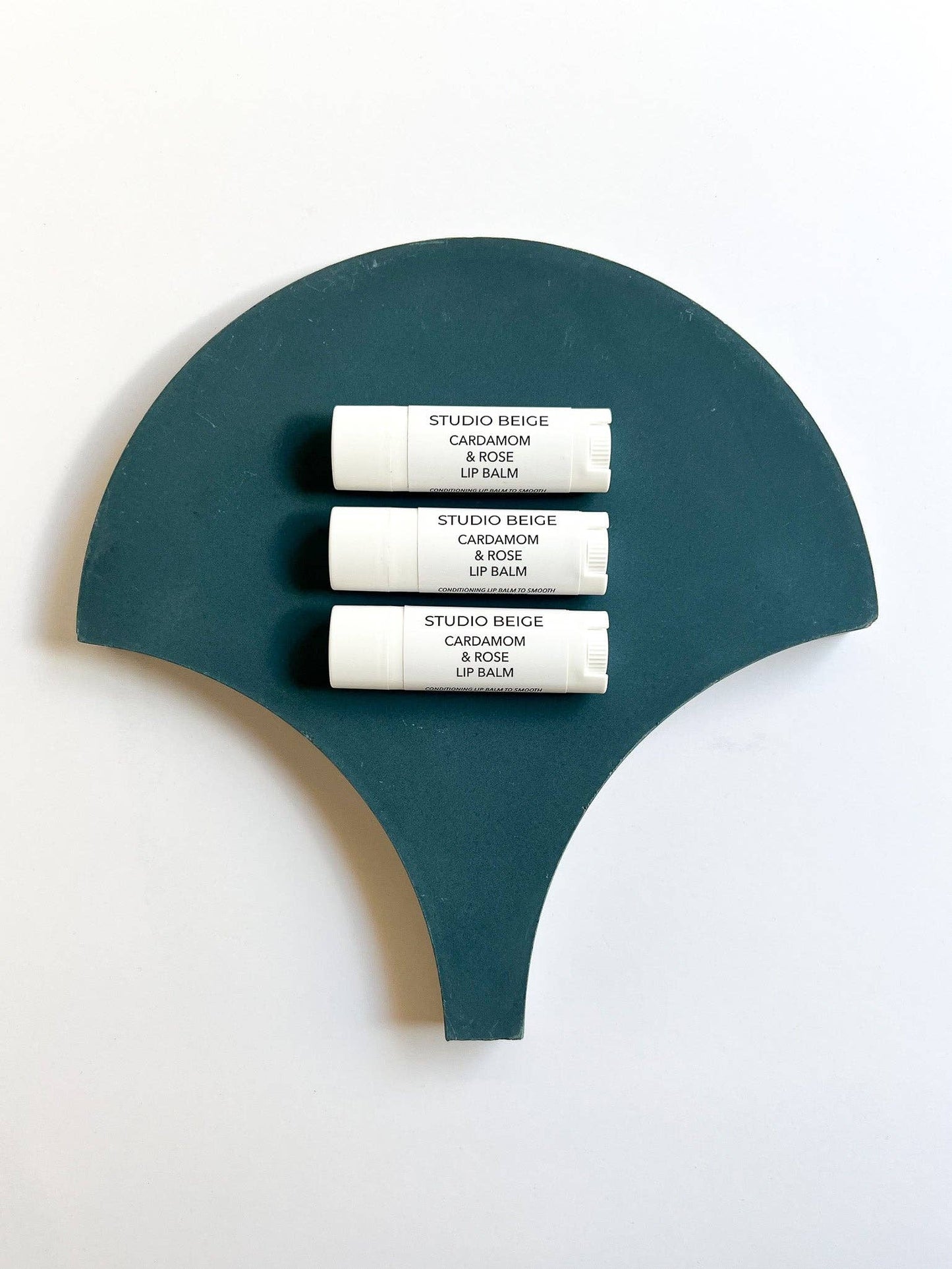 STUDIO BEIGE CARDAMOM & ROSE conditioning lip balm with cardamom, rose, & mango butter